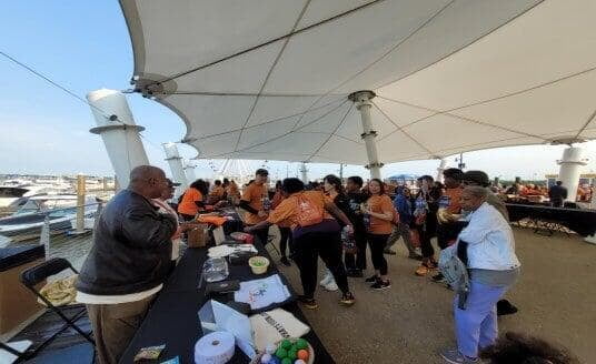 Outdoor Share Life Gifts community event under a tent